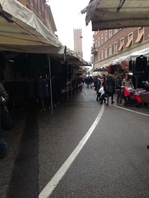 View down the closed streets of Cremona as locals haggle for a good deal. 