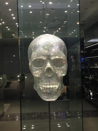 Boutique storefront in Barcelona, Spain. Fierce skull covered in sparkling crystals!